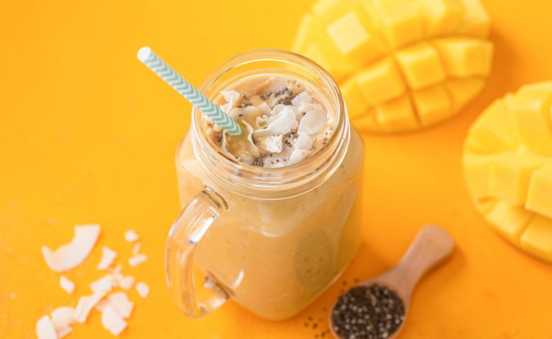 coconut and mango smoothie glass for breakfast