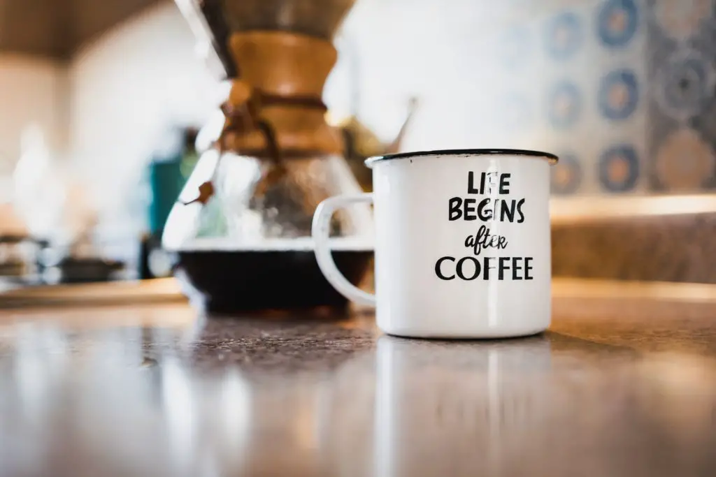 a coffee mug with a coffee maker - frugal living tips for moms in 2020